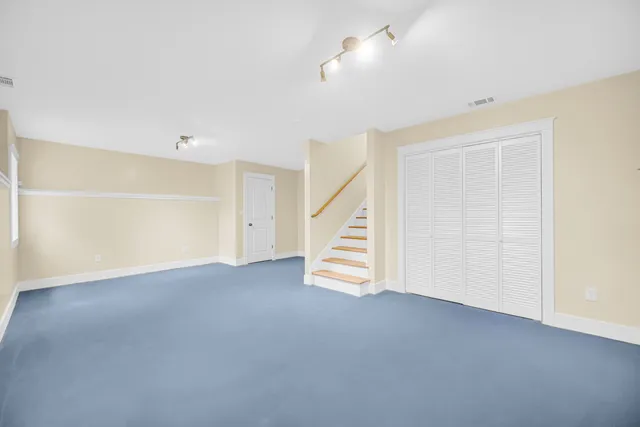 a view of an empty room with stairs