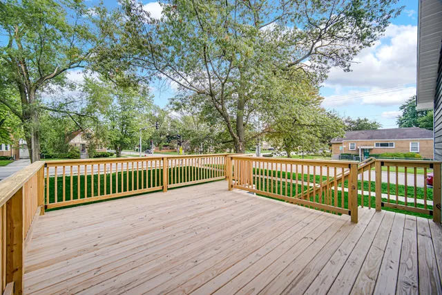 a view of deck with wooden floor and fence