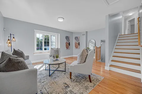 a living room with furniture and a window