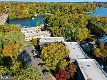 an aerial view of a house with a lake view