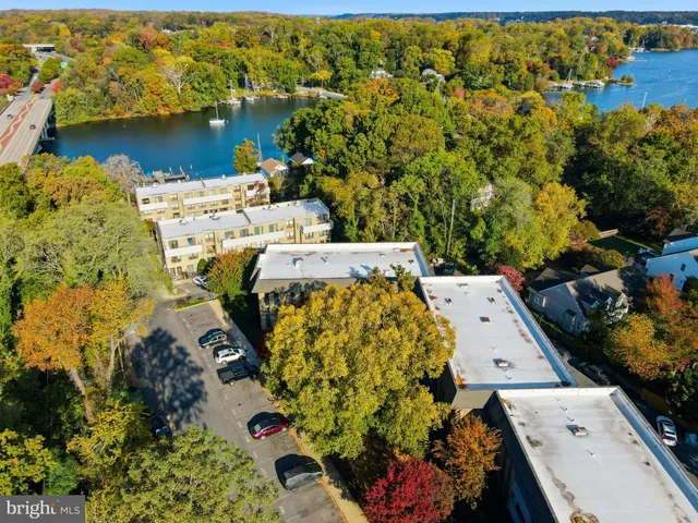an aerial view of a house with a lake view