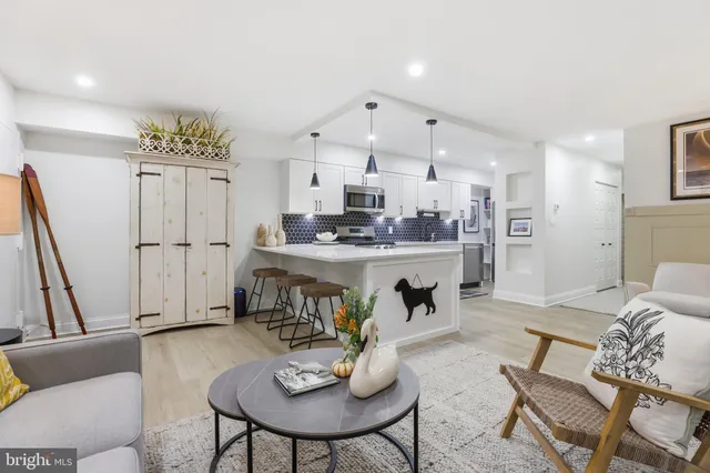 a living room with furniture and a table