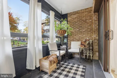 a room with furniture and a window