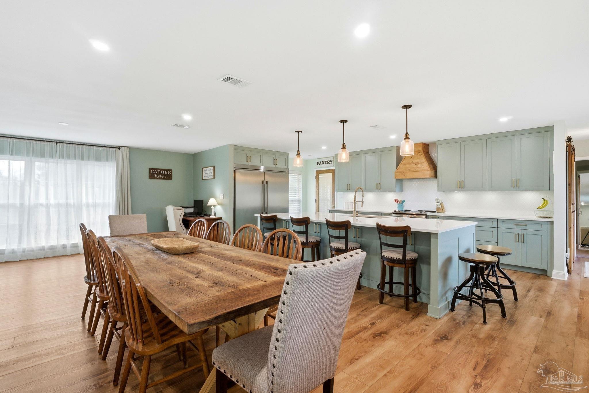 690 Cooley Road Cantonment, FL 32533 - Photo 19 of 64 a view of a dining room with furniture