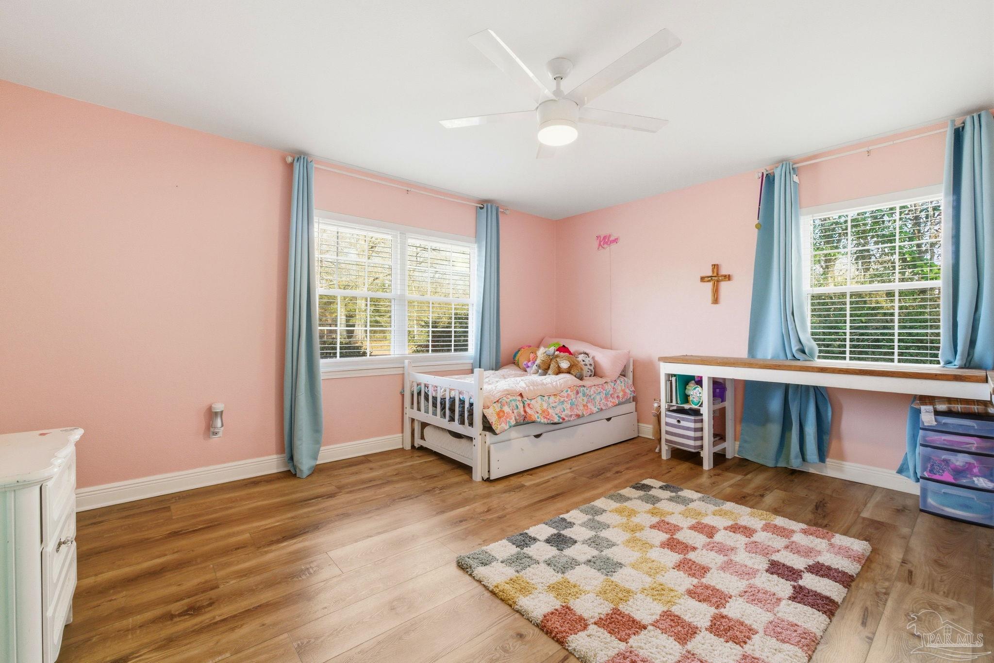 690 Cooley Road Cantonment, FL 32533 - Photo 28 of 64 a bedroom with a bed and a window