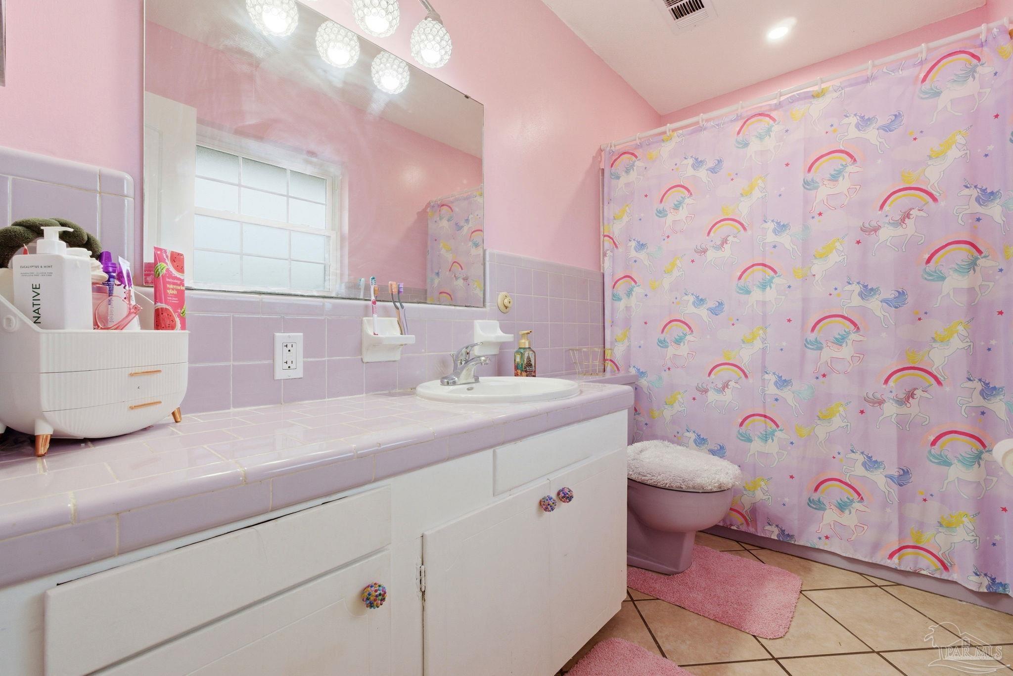 690 Cooley Road Cantonment, FL 32533 - Photo 30 of 64 a bathroom with a sink toilet and shower