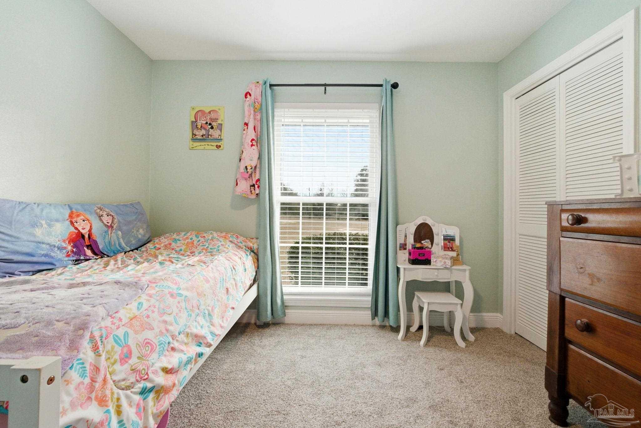 690 Cooley Road Cantonment, FL 32533 - Photo 31 of 64 a bedroom with a bed and a window