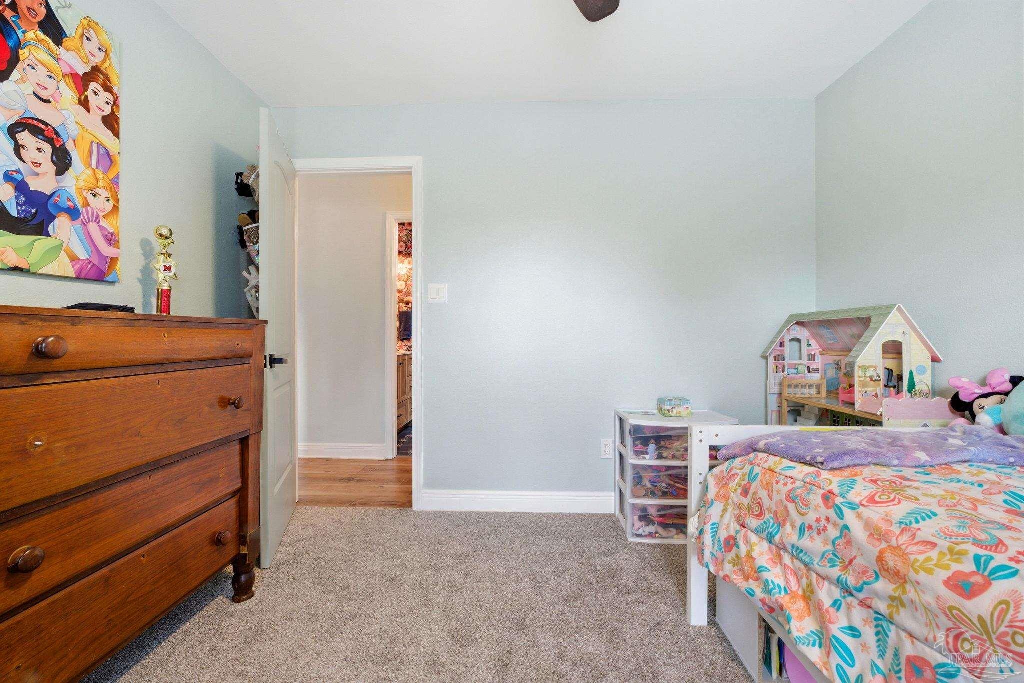 690 Cooley Road Cantonment, FL 32533 - Photo 33 of 64 a bedroom with a bed and cabinets
