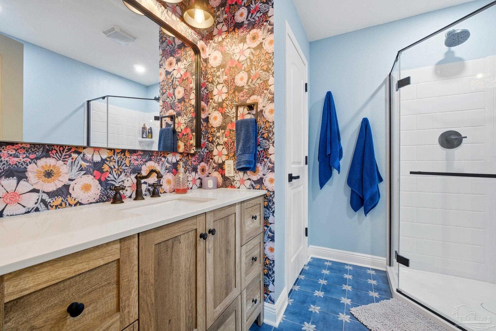 690 Cooley Road Cantonment, FL 32533 - Photo 34 of 64 a bathroom with a sink and a shower