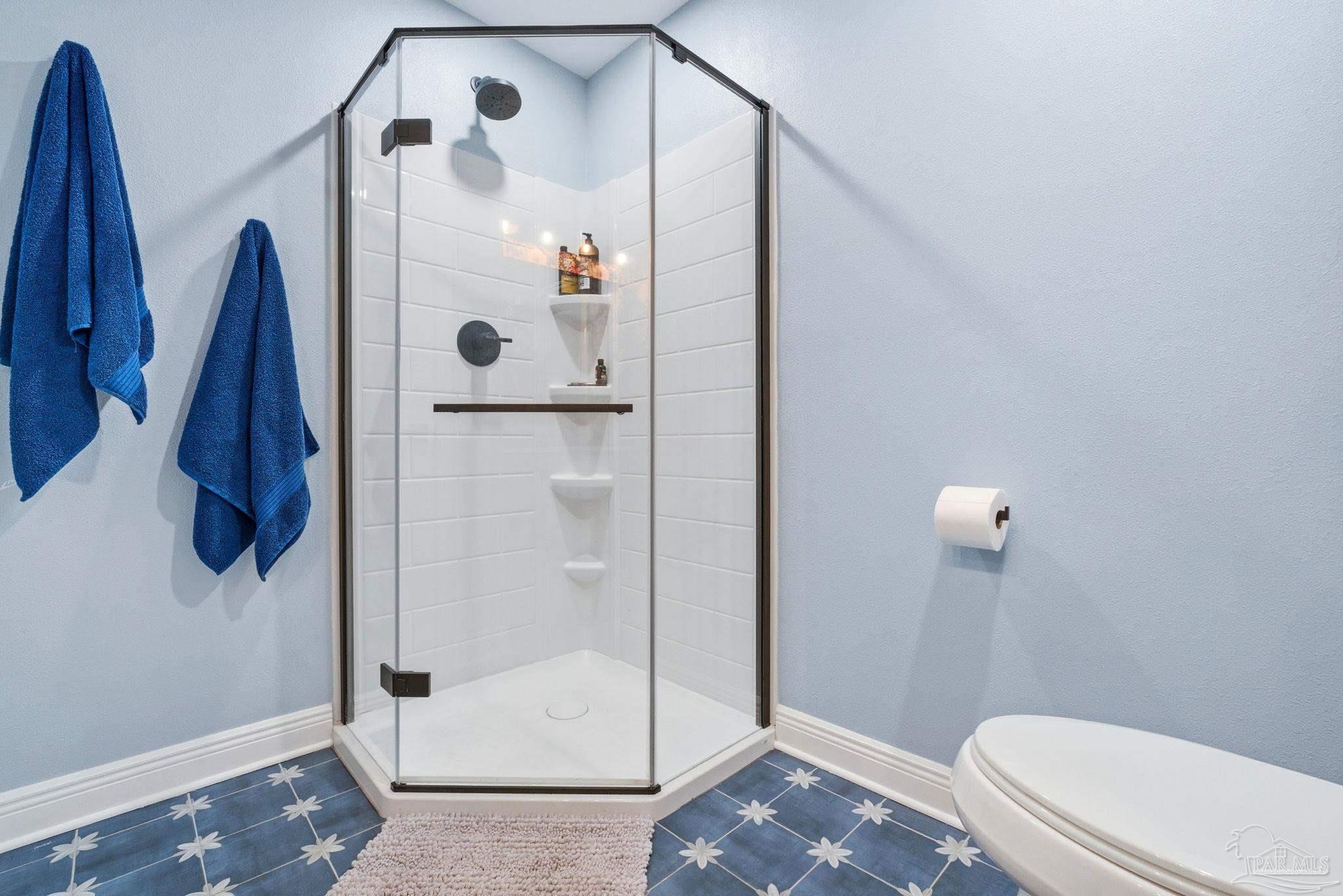 690 Cooley Road Cantonment, FL 32533 - Photo 35 of 64 a bathroom with a shower and toilet
