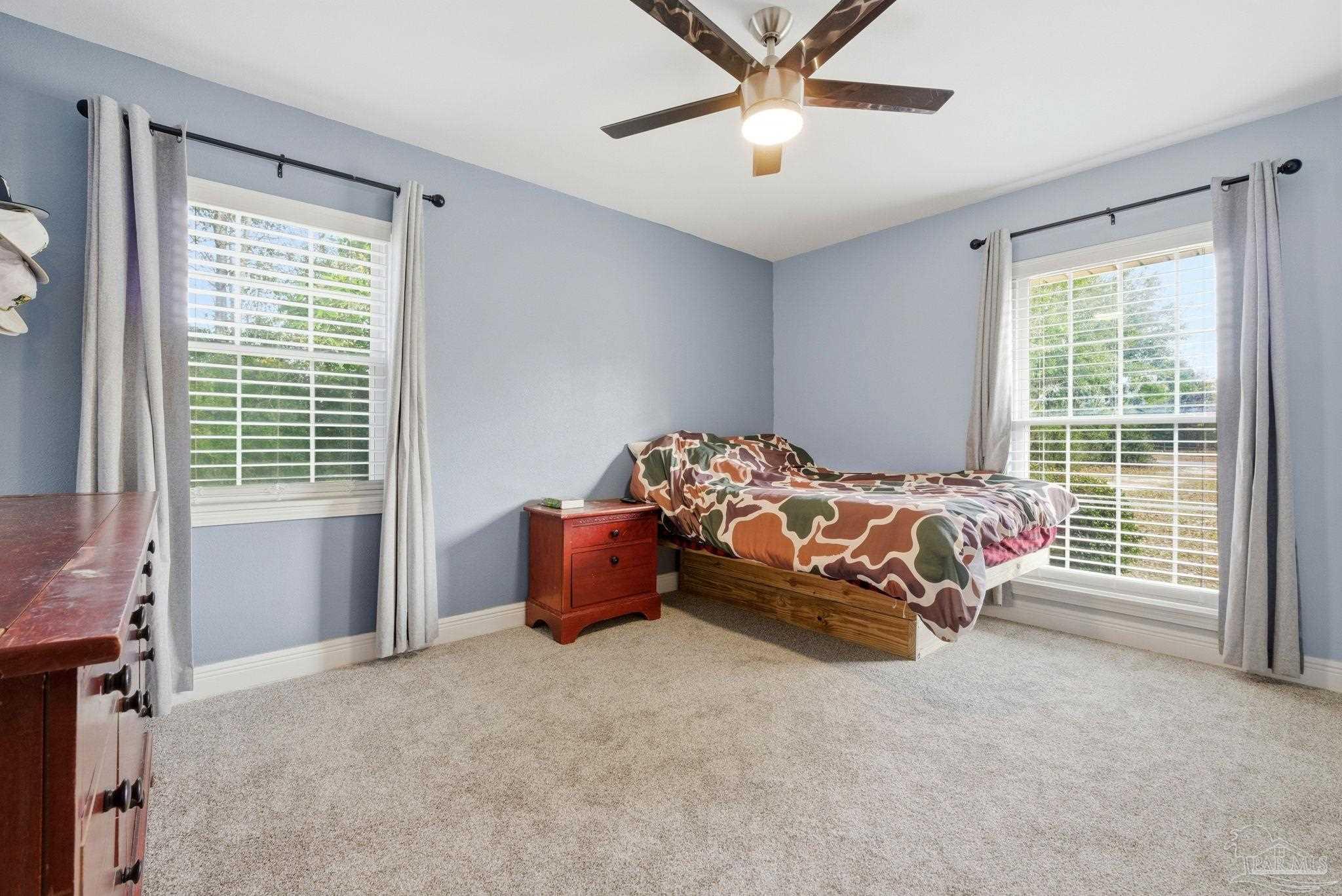 690 Cooley Road Cantonment, FL 32533 - Photo 36 of 64 a bedroom with bed and window