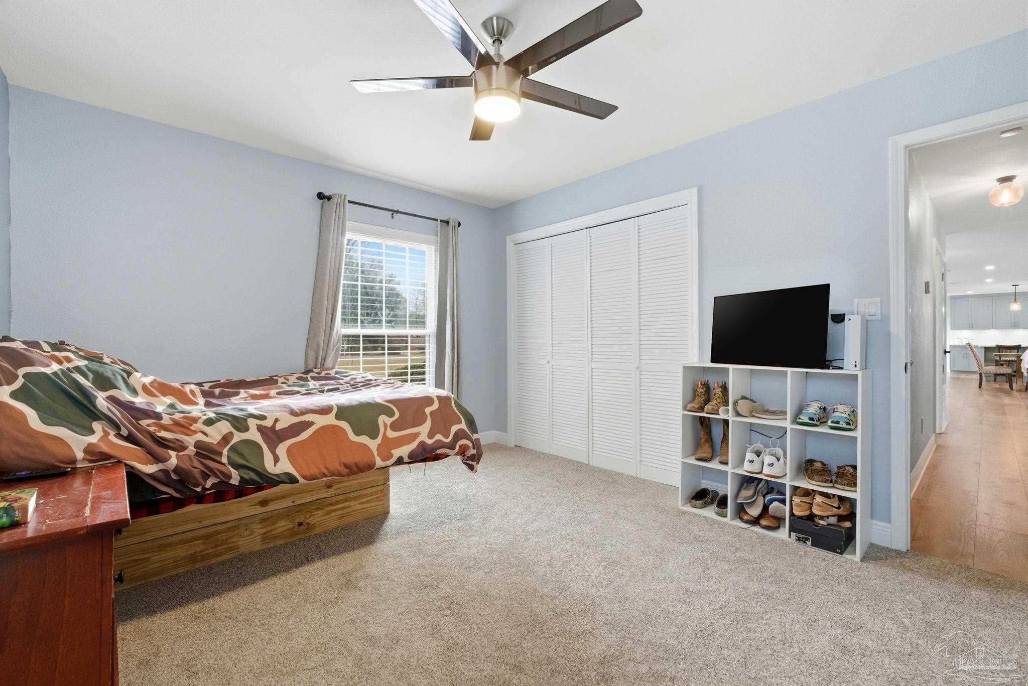 690 Cooley Road Cantonment, FL 32533 - Photo 37 of 64 a bed room with a bed and a television