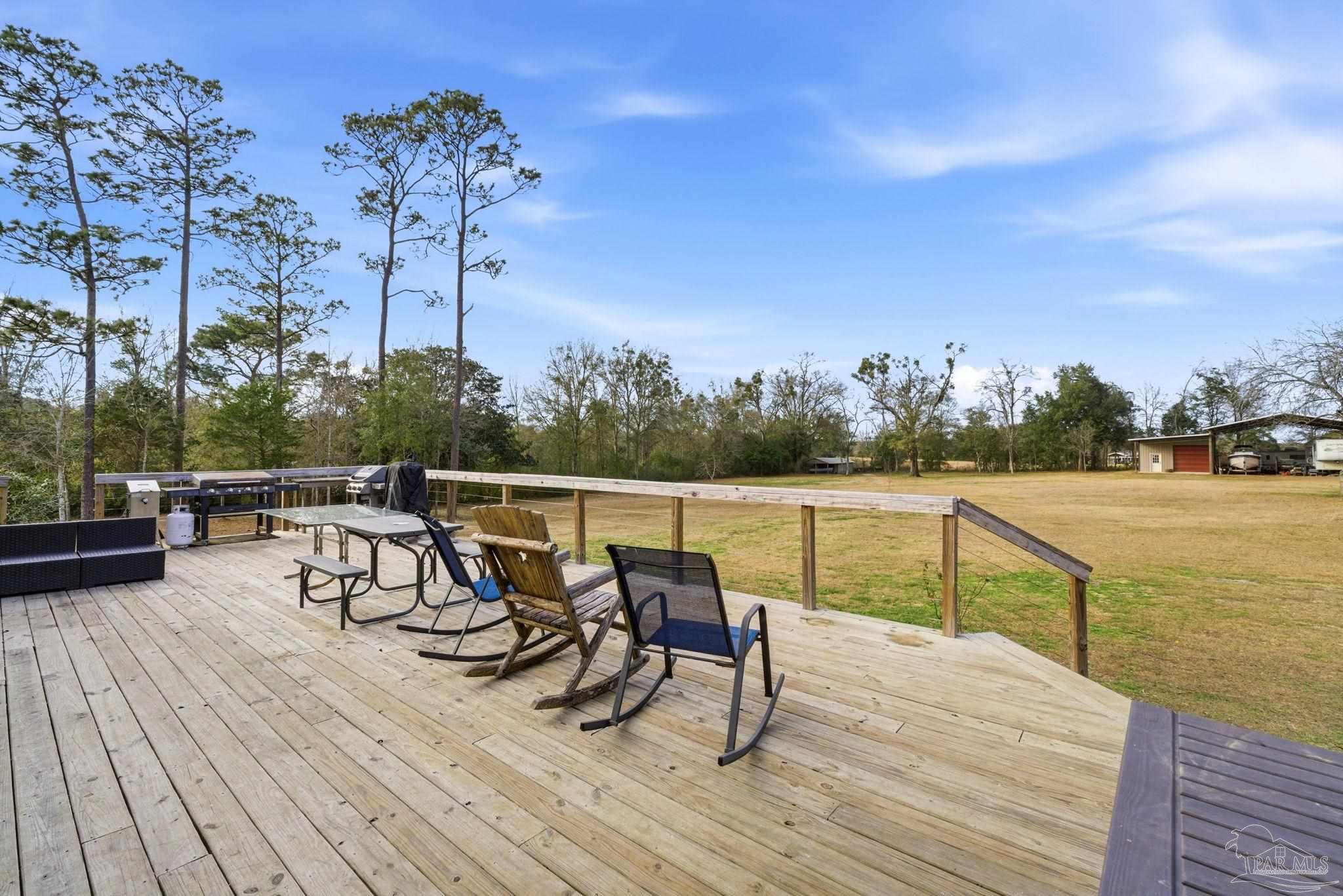 690 Cooley Road Cantonment, FL 32533 - Photo 42 of 64 a view of outdoor space with seating area