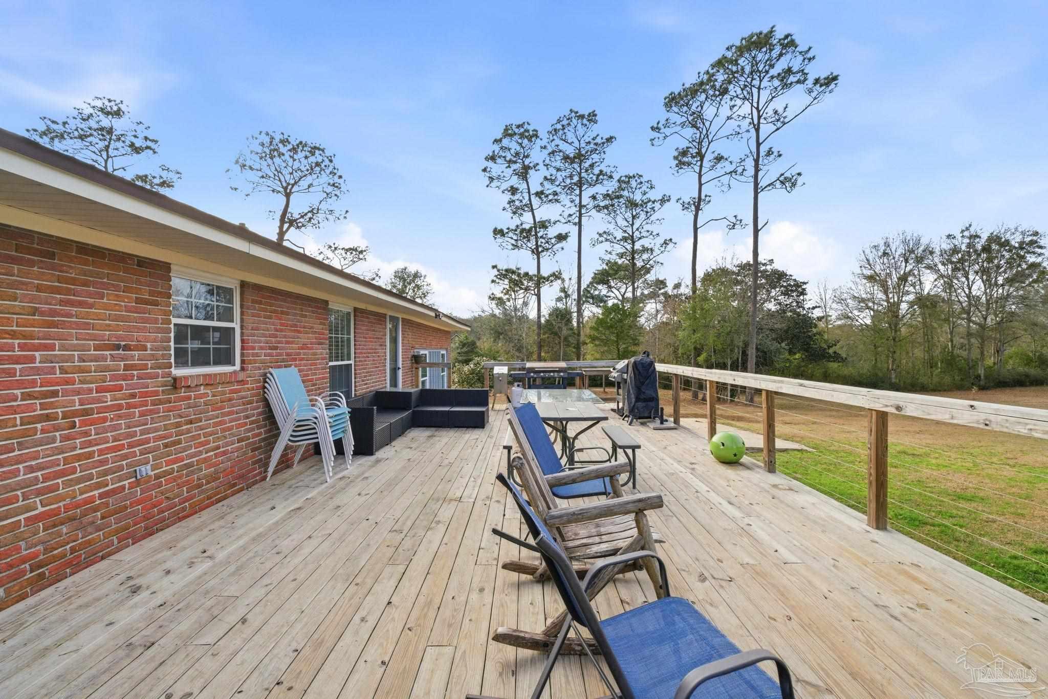 690 Cooley Road Cantonment, FL 32533 - Photo 43 of 64 a view of a patio with wooden floor
