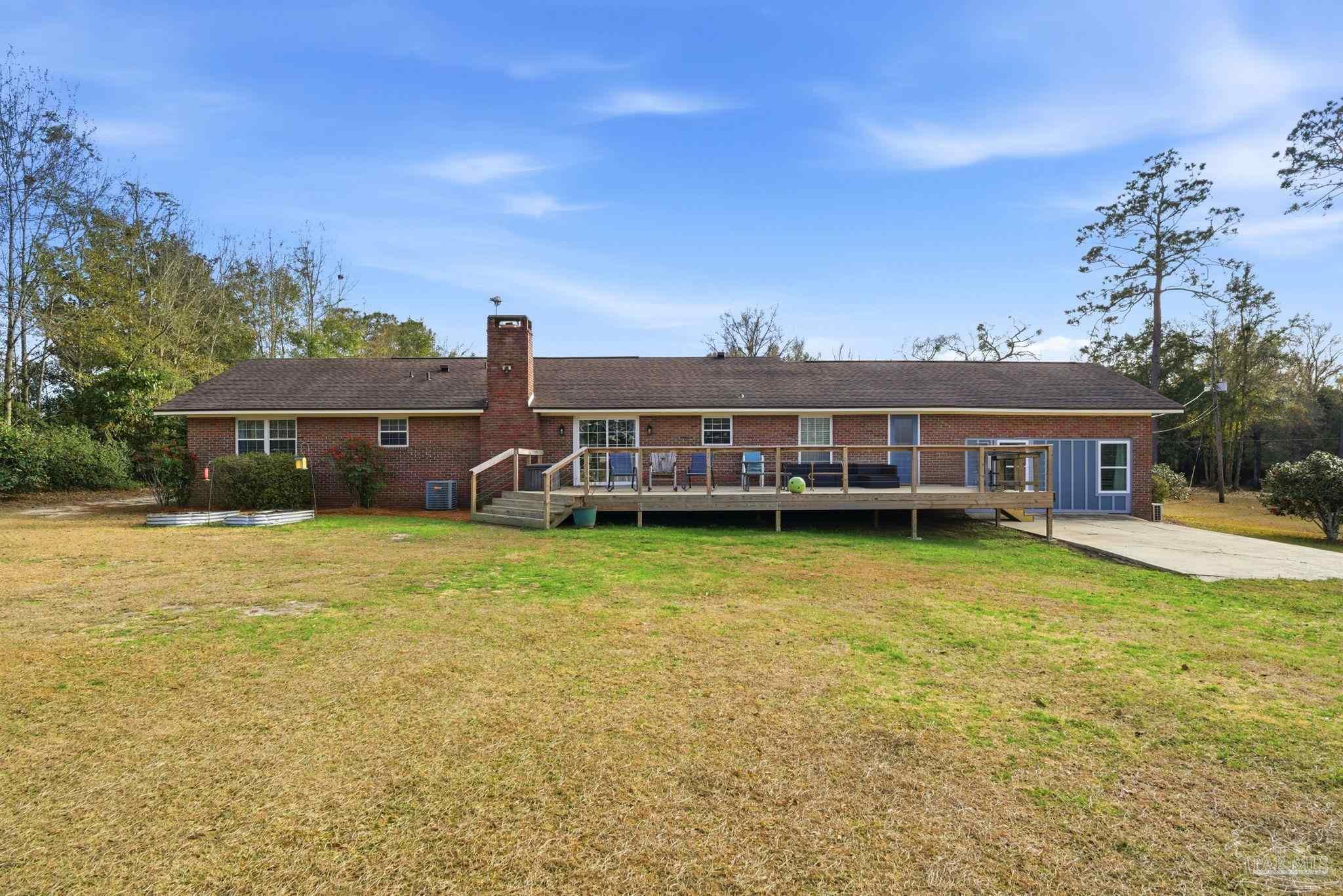 690 Cooley Road Cantonment, FL 32533 - Photo 46 of 64 a view of a house with a swimming pool