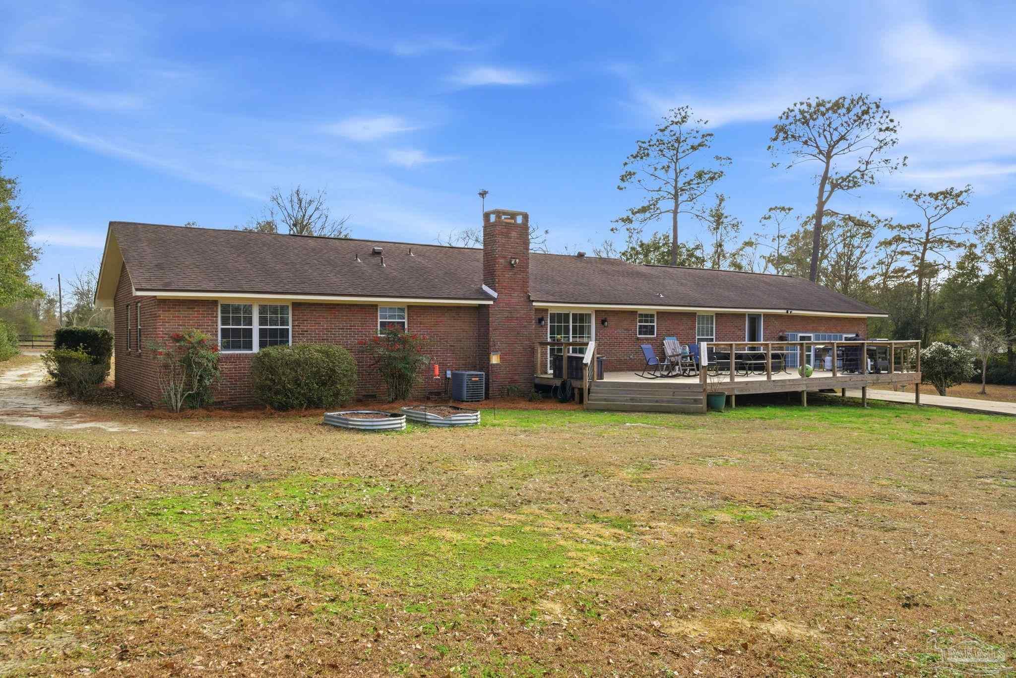 690 Cooley Road Cantonment, FL 32533 - Photo 47 of 64 a front view of a house with a garden
