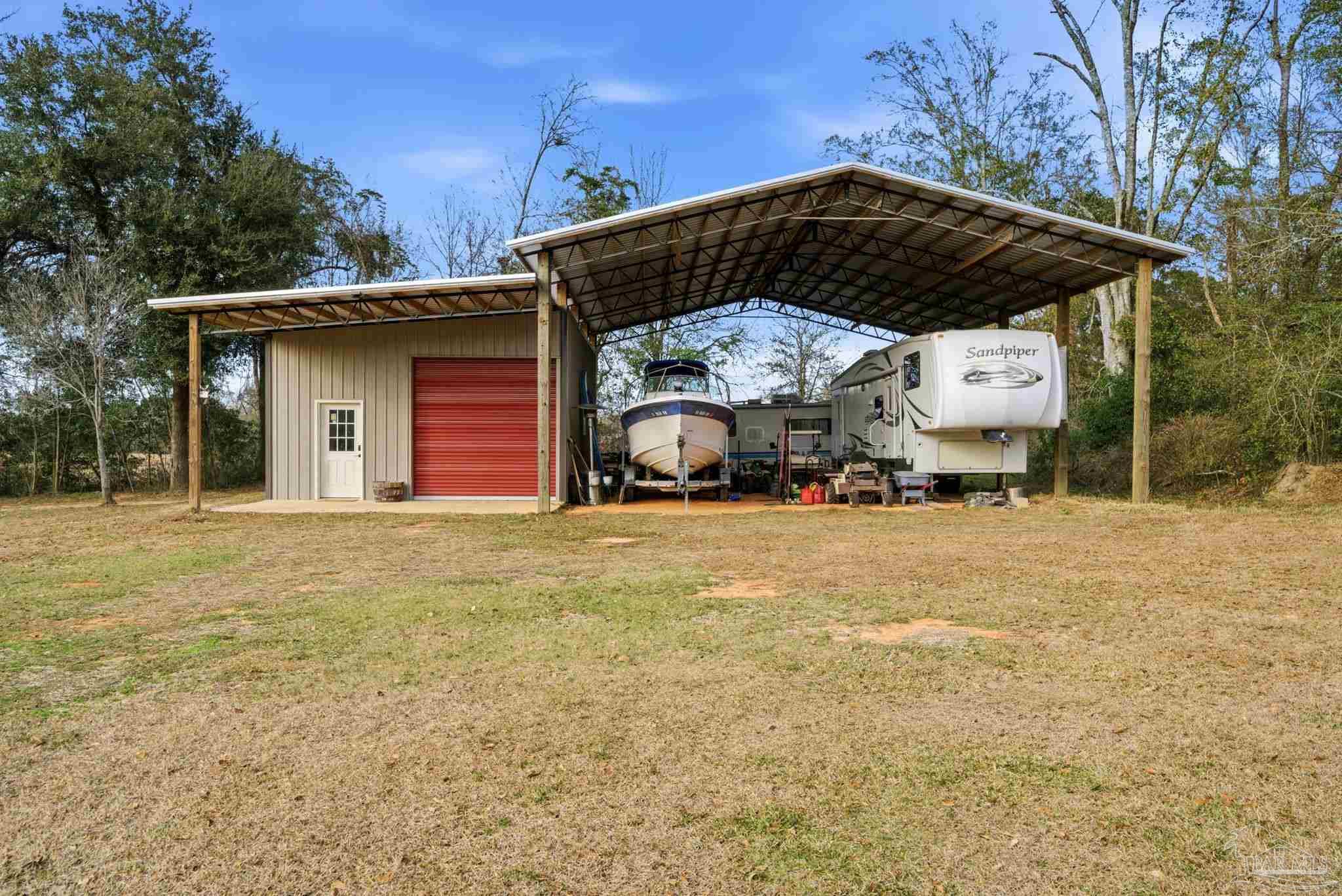 690 Cooley Road Cantonment, FL 32533 - Photo 49 of 64 a view of a car park in front of house