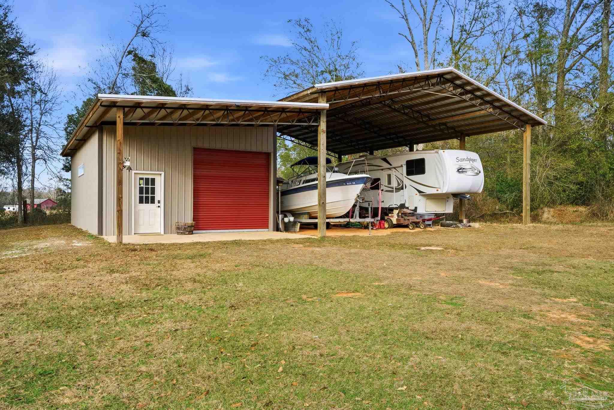 690 Cooley Road Cantonment, FL 32533 - Photo 50 of 64 a view of outdoor space and front view of a house