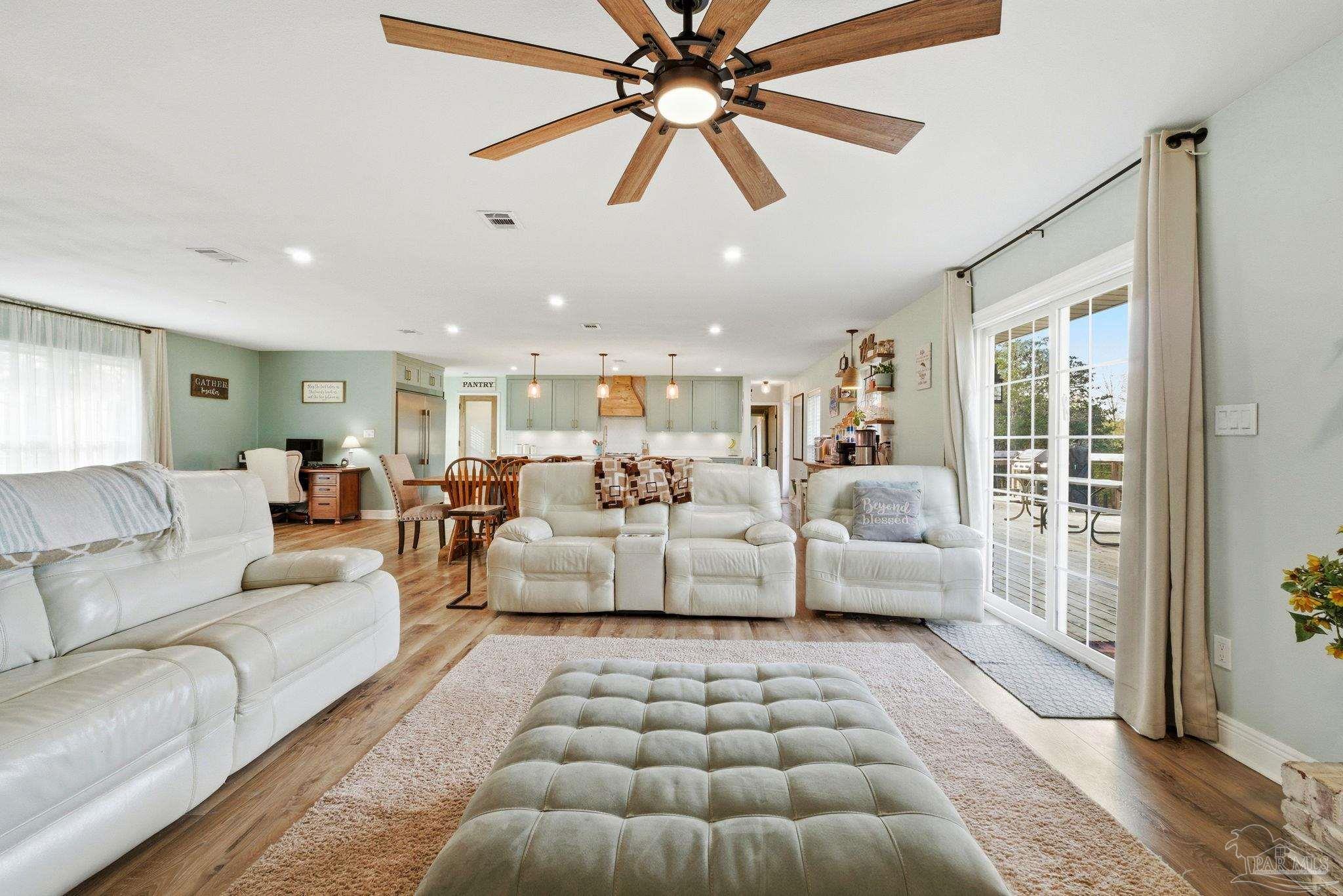 690 Cooley Road Cantonment, FL 32533 - Photo 5 of 64 a living room with furniture and a rug