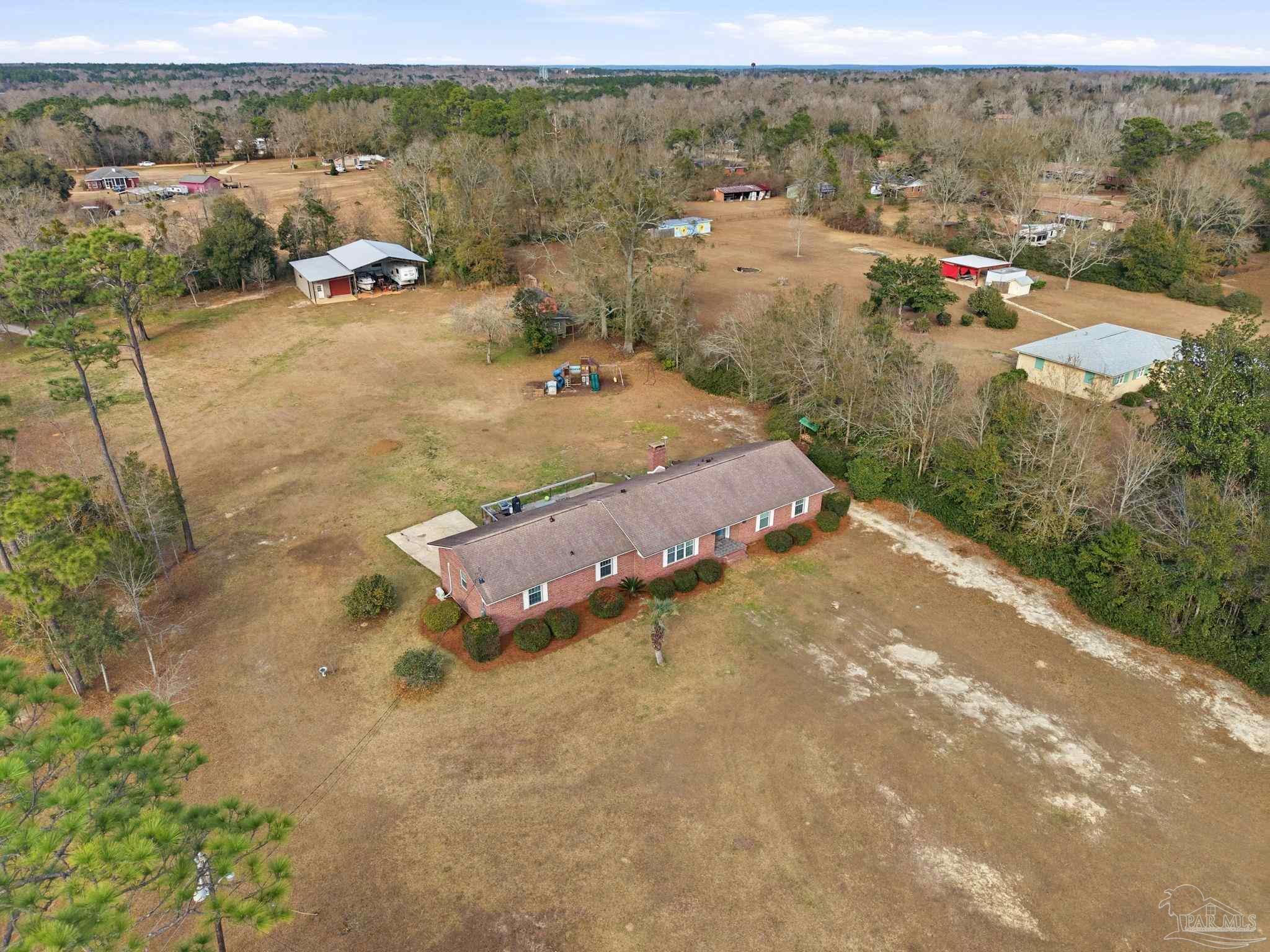690 Cooley Road Cantonment, FL 32533 - Photo 54 of 64 an aerial view of residential houses with outdoor space