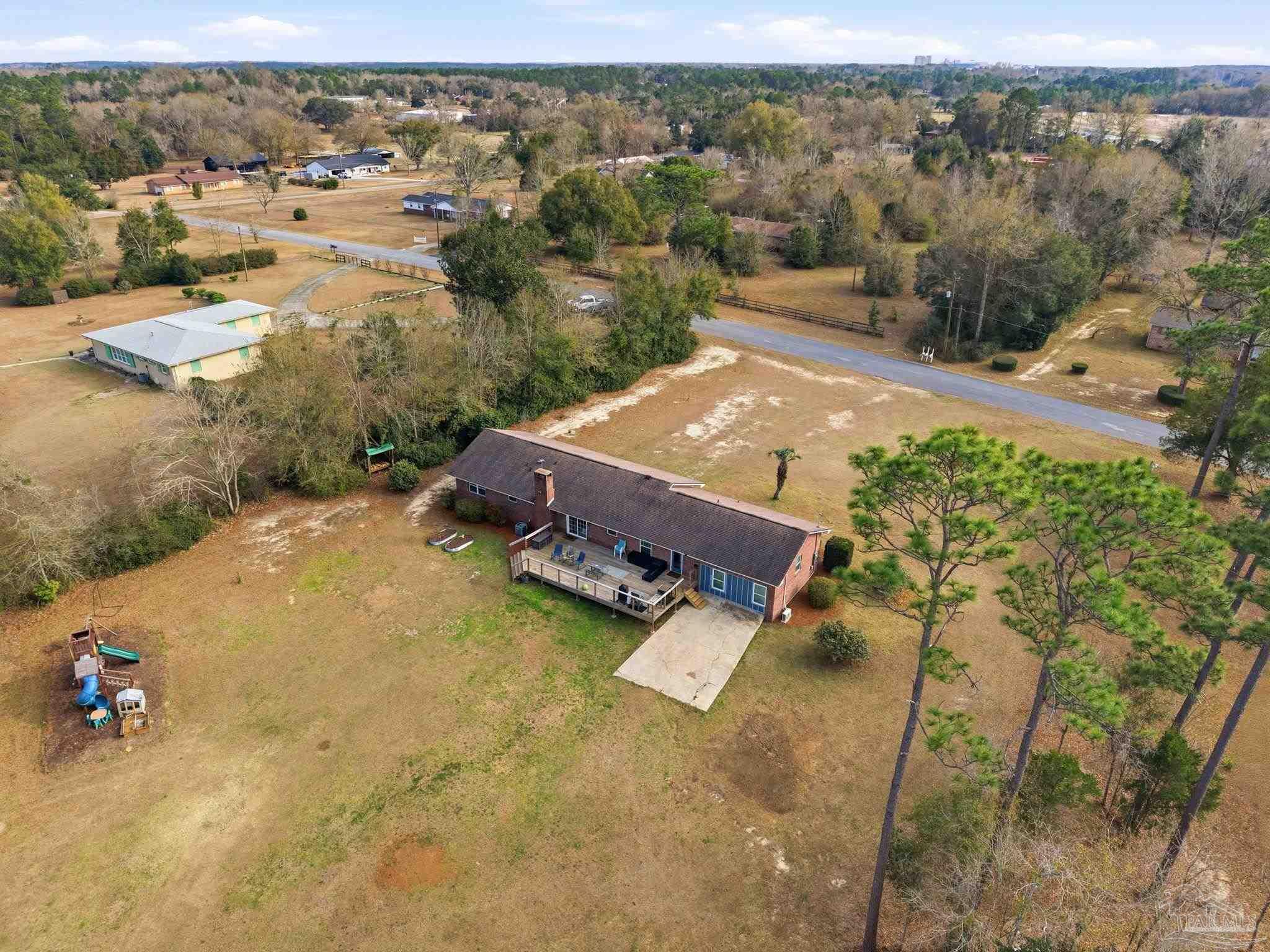 690 Cooley Road Cantonment, FL 32533 - Photo 55 of 64 an aerial view of houses with yard