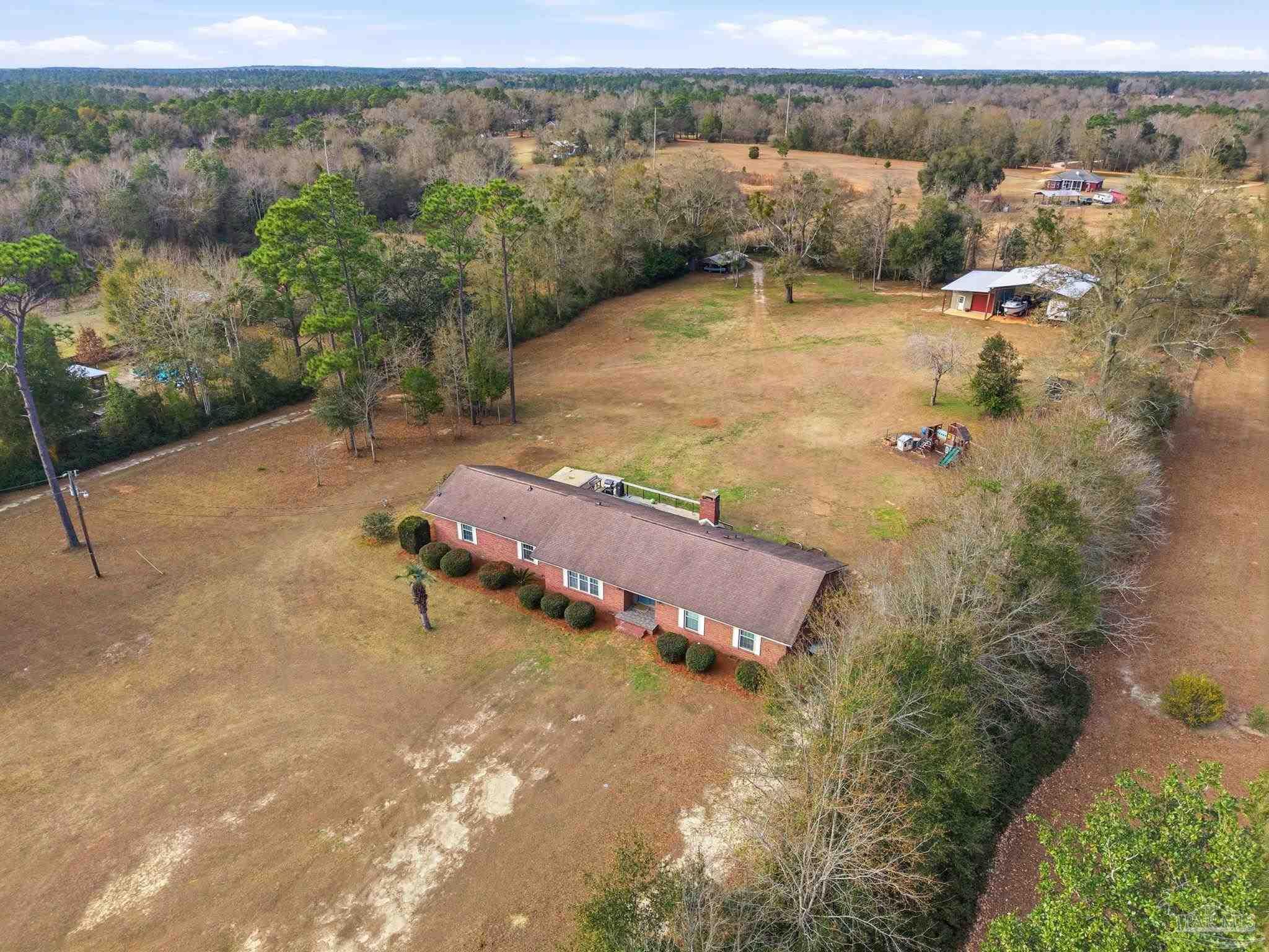 690 Cooley Road Cantonment, FL 32533 - Photo 57 of 64 an aerial view of a house with a yard