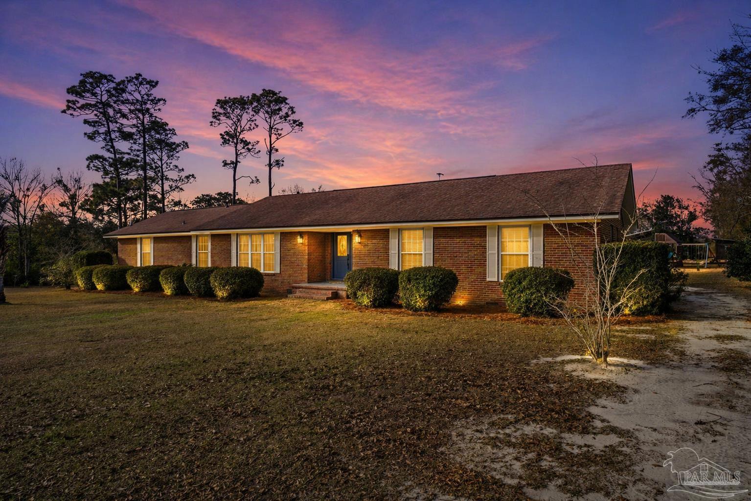 690 Cooley Road Cantonment, FL 32533 - Photo 8 of 64 a front view of a house with a yard