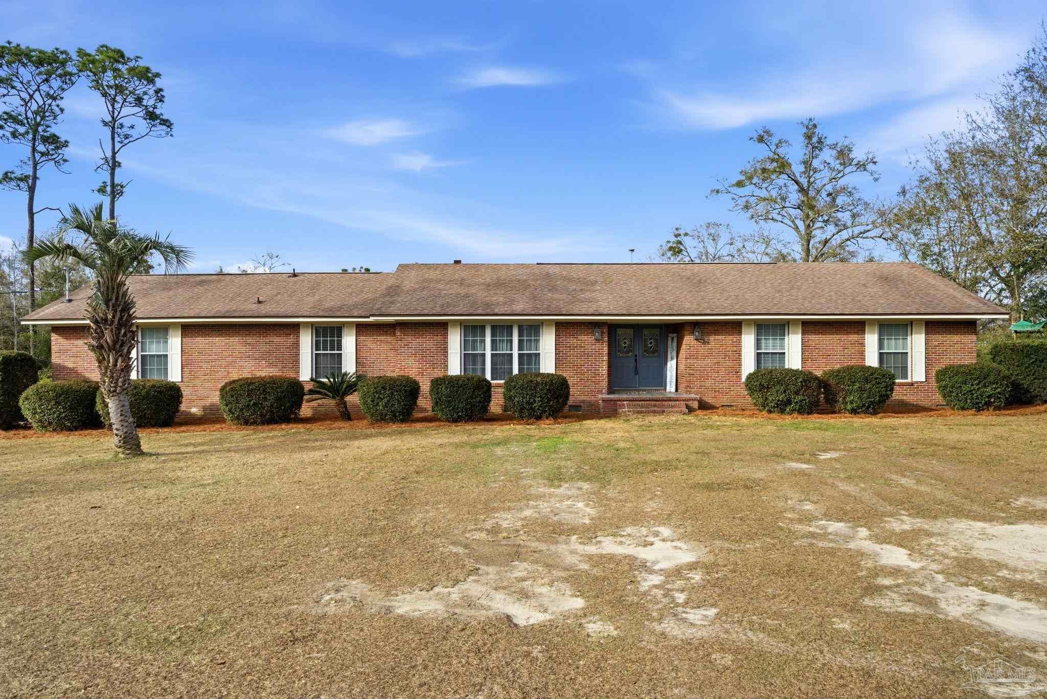 690 Cooley Road Cantonment, FL 32533 - Photo 9 of 64 a front view of a house with a yard