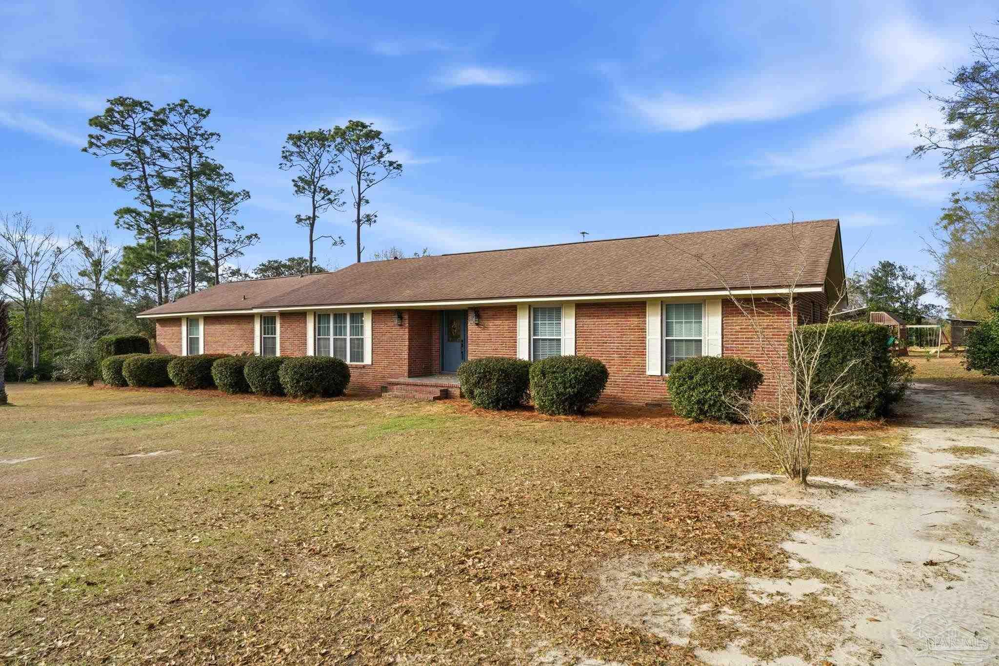690 Cooley Road Cantonment, FL 32533 - Photo 10 of 64 a front view of a house with a yard