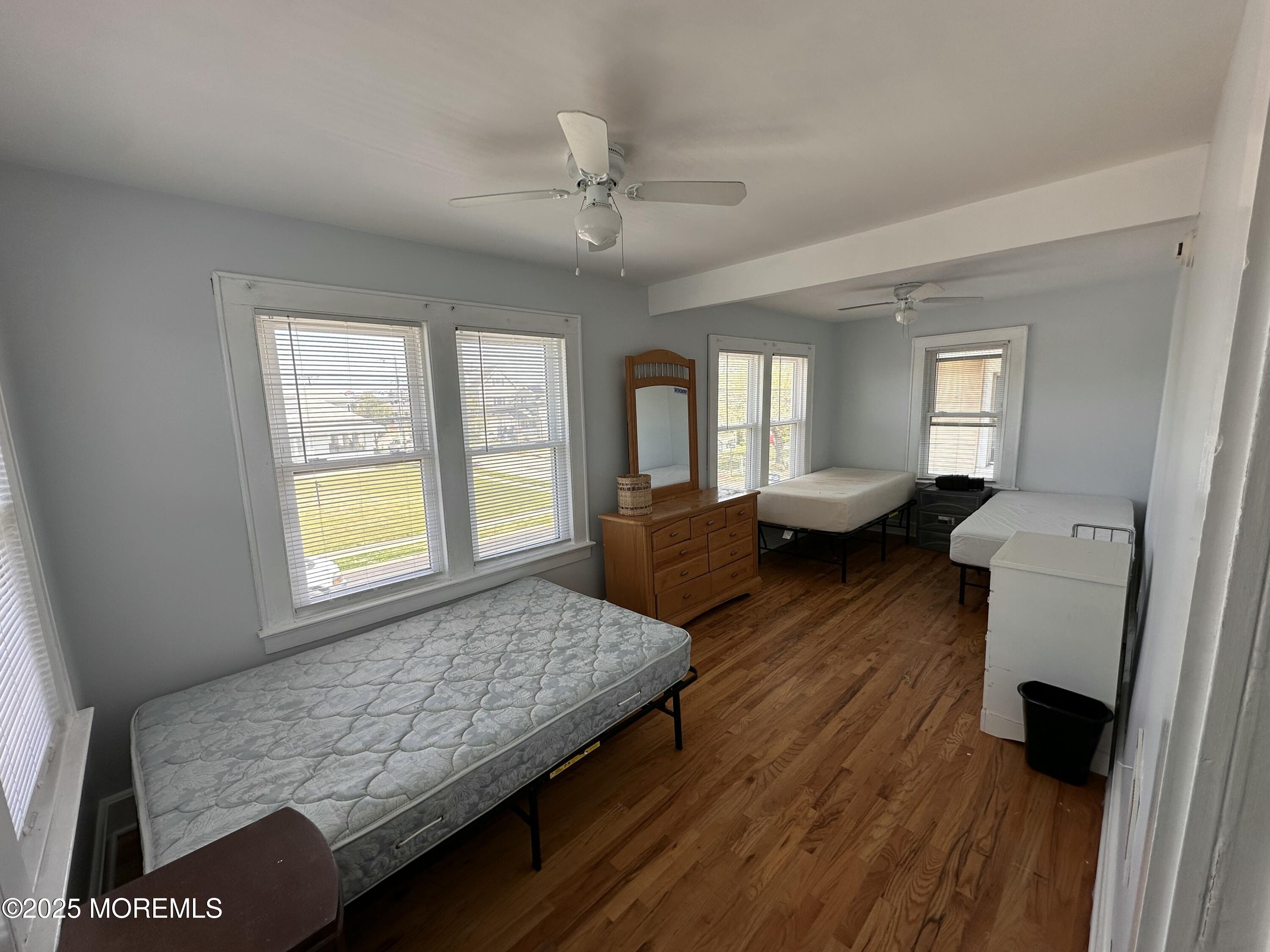 203 16th Avenue Belmar, NJ 07719 - Photo 5 of 13 a living room with furniture and a wooden floor