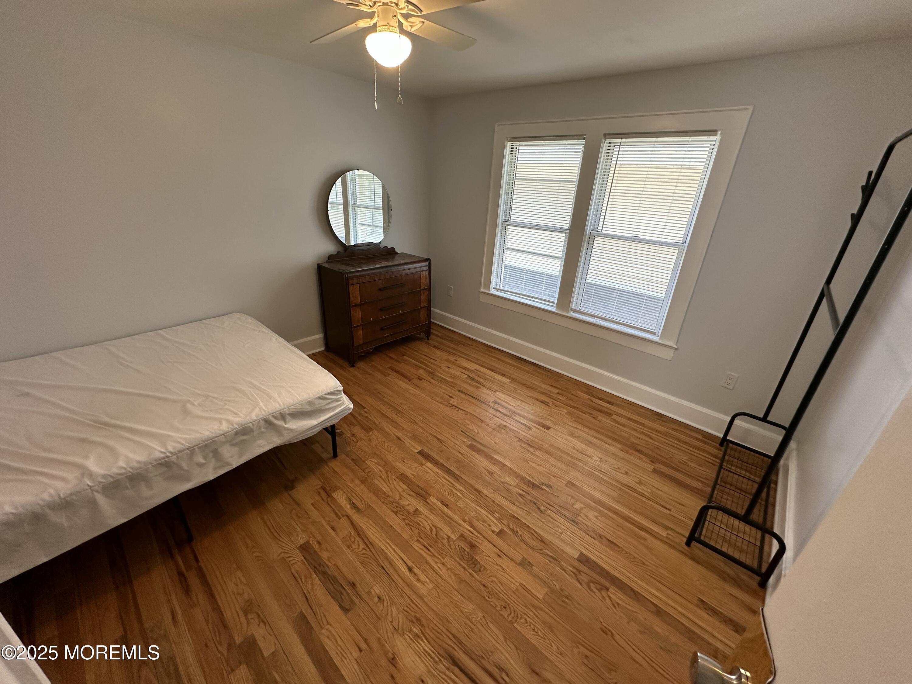 203 16th Avenue Belmar, NJ 07719 - Photo 6 of 13 a bedroom with bed and window
