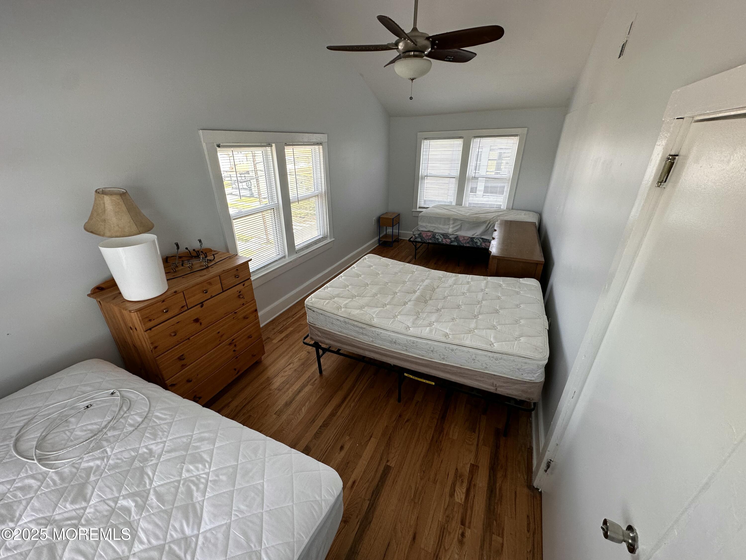 203 16th Avenue Belmar, NJ 07719 - Photo 8 of 13 a bed room with a bed and window