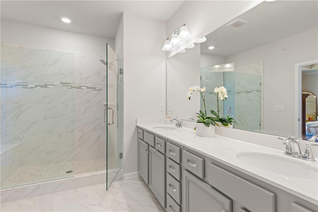 4781 Highside Way Southeast Smyrna, GA 30082 - Photo 22 of 33 a bathroom with a double vanity sink mirror and shower