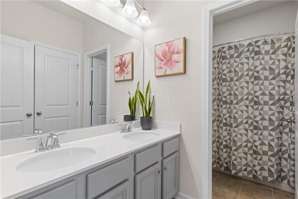 4781 Highside Way Southeast Smyrna, GA 30082 - Photo 24 of 33 a bathroom with a sink mirror and vanity