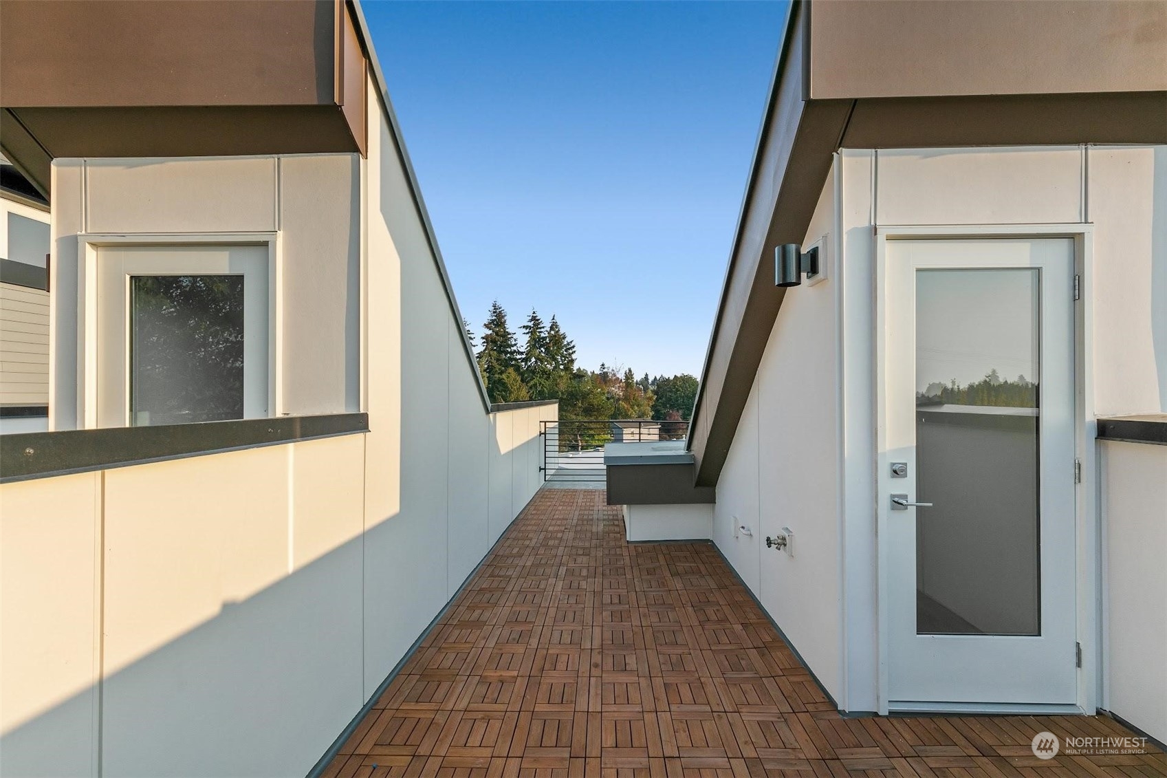 10148 Holman Road Northwest Seattle, WA 98133 - Photo 22 of 38 a view of a hallway with wooden floor and staircase