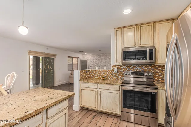 a view of a livingroom with furniture & wooden floor