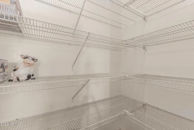 a living room with a bed furniture and a window