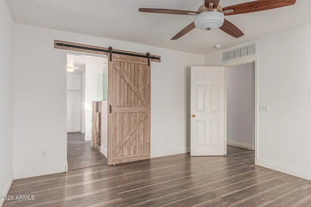 a view of a bathroom with a shower and a window