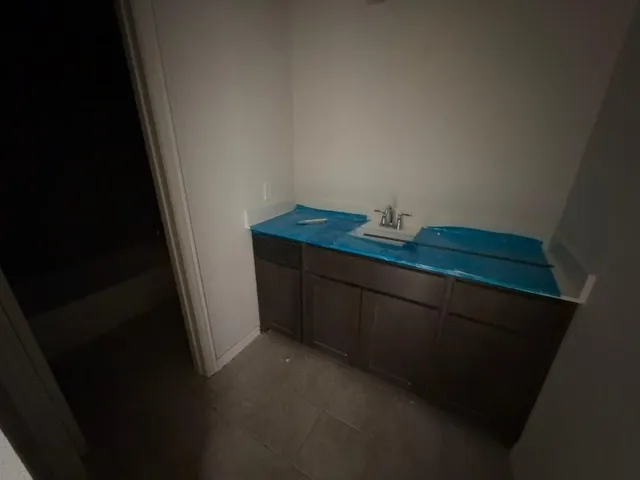 a utility room with cabinets