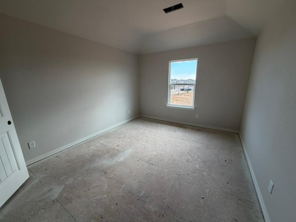 1224 Sabine River Lane Springtown, TX 76082 - Photo 10 of 17 a view of an empty room with a window