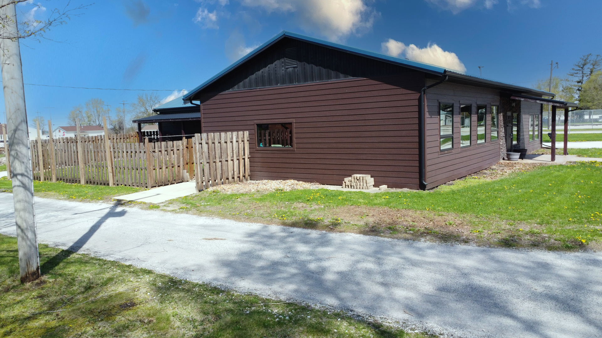 201 Main Street Crescent City, IL 60928 - Photo 11 of 65 a front view of a house with a yard and garage
