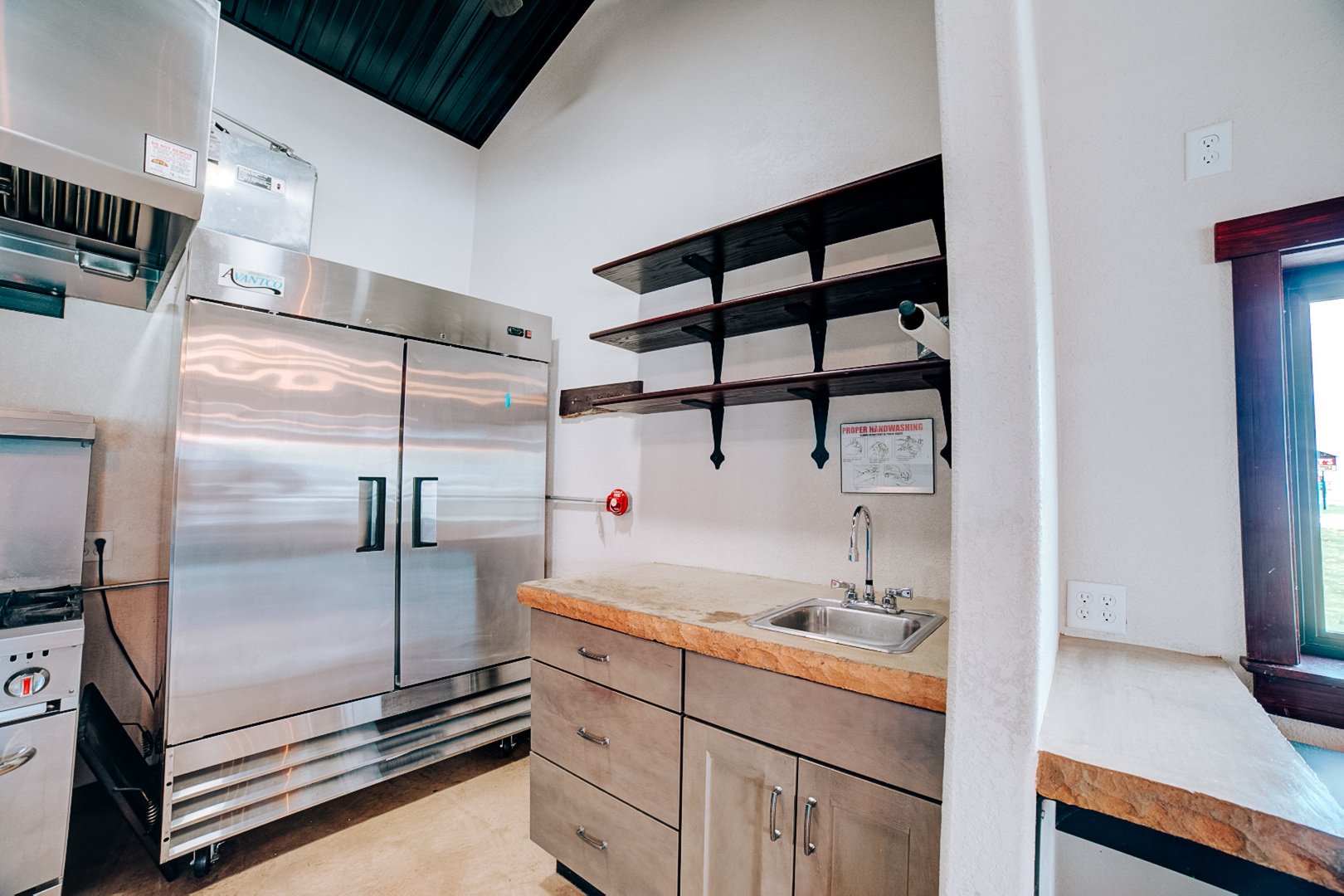 201 Main Street Crescent City, IL 60928 - Photo 20 of 65 a kitchen with kitchen island a counter top space a sink and stainless steel appliances