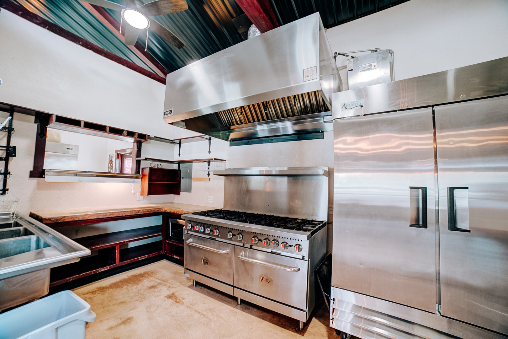 201 Main Street Crescent City, IL 60928 - Photo 21 of 65 a kitchen with kitchen island granite countertop a stove a refrigerator and a cabinets