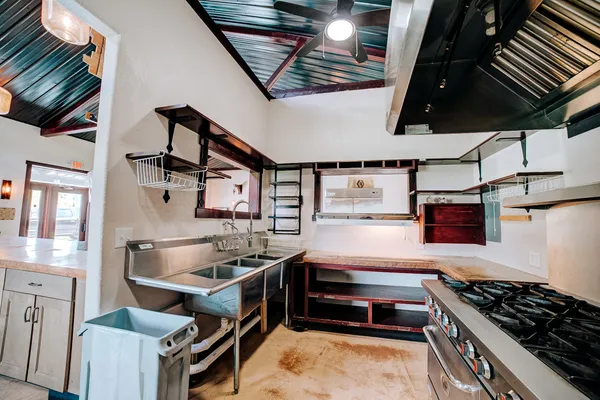 a kitchen with a stove and a microwave