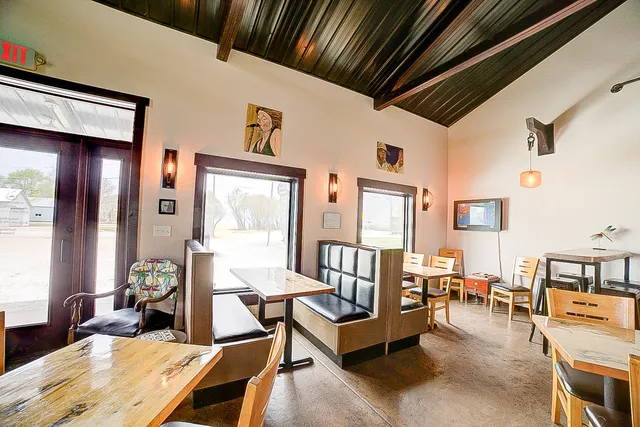 a dining room with furniture and a chandelier