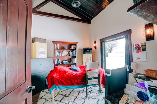 a view of a patio with table and chairs with wooden floor