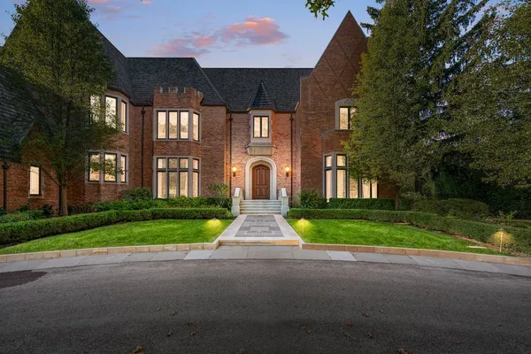 a view of hall way with furniture and large windows