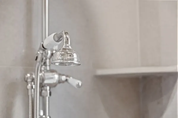 a kitchen with granite countertop a stove a sink and a shower