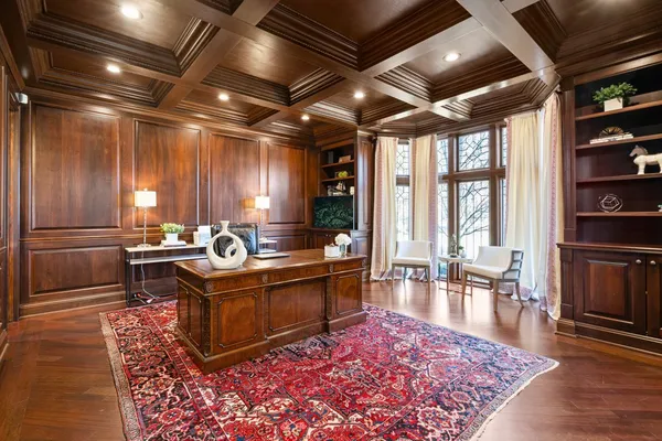 a spacious bedroom with a balcony a bed and a fireplace