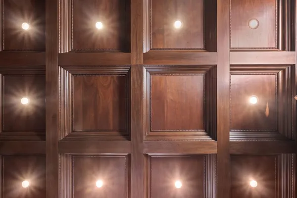 a view of a hallway with wooden floor and entryway